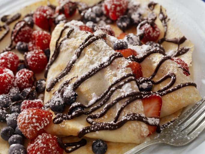 Crepes with Fresh Berries, Chocolate Sauce and Powdered sugar -Photographed on a Hasselblad H3D11-39 megapixel Camera System