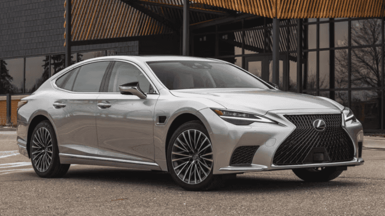 Silver Lexus LS parked in front of a building