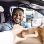 Wesley Chapel Food Scene -Happy Man Receiving Takeout Food in Car