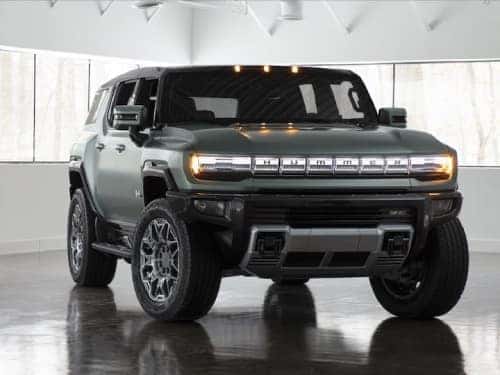 2024 GMC Hummer EV SUV exterior view parked in a showroom
