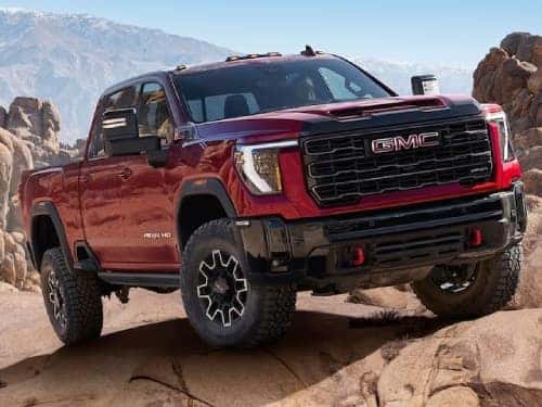 2025 GMC Sierra HD exterior view parked on a rocky hill