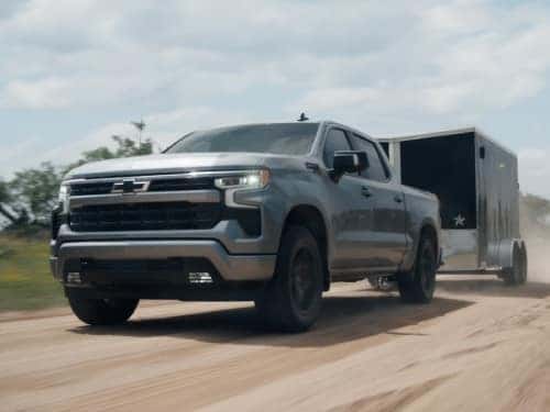 2025 Chevrolet Silverado 1500 towing an enclosed trailer
