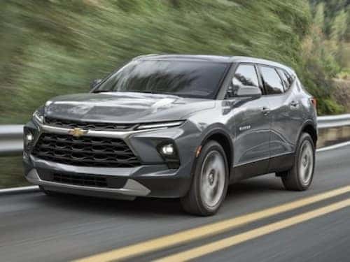 2025 Chevrolet Blazer driving down a road
