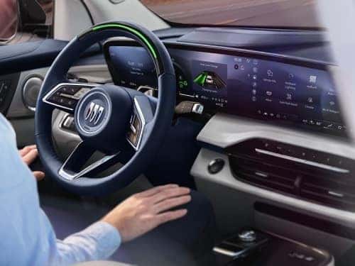 2025 Buick Enclave view of person in driver's seat with hands on lap and vehicle is in super cruise mode