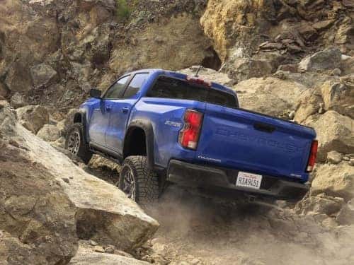 2025 Chevrolet Colorado offroading up a rocky hill
