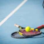 Tennis Racket And Ball On The Court