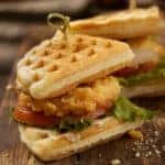 Fried Chicken and Waffle Sandwich with Lettuce and Tomato.