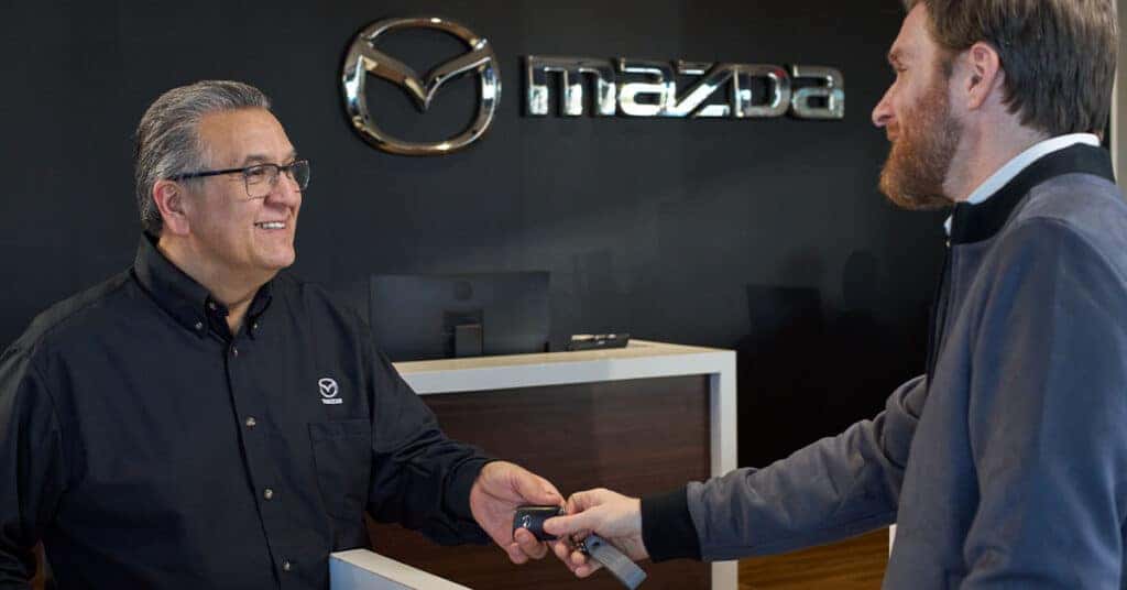 Med Center Mazda Service - two men shaking hands