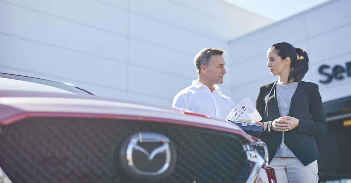 Customer speaking to salesperson about the Mazda Extended Warranty