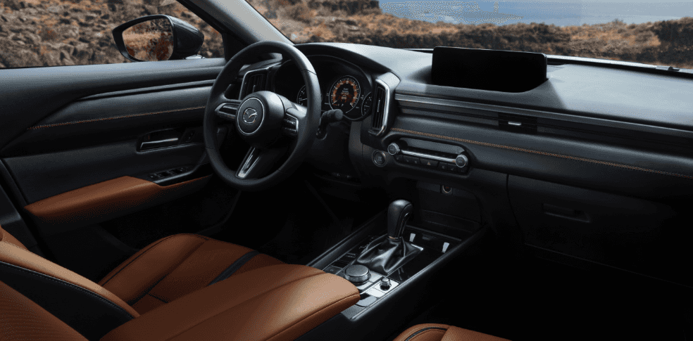 2026 Mazda CX-50 interior with brown leather seats and center console