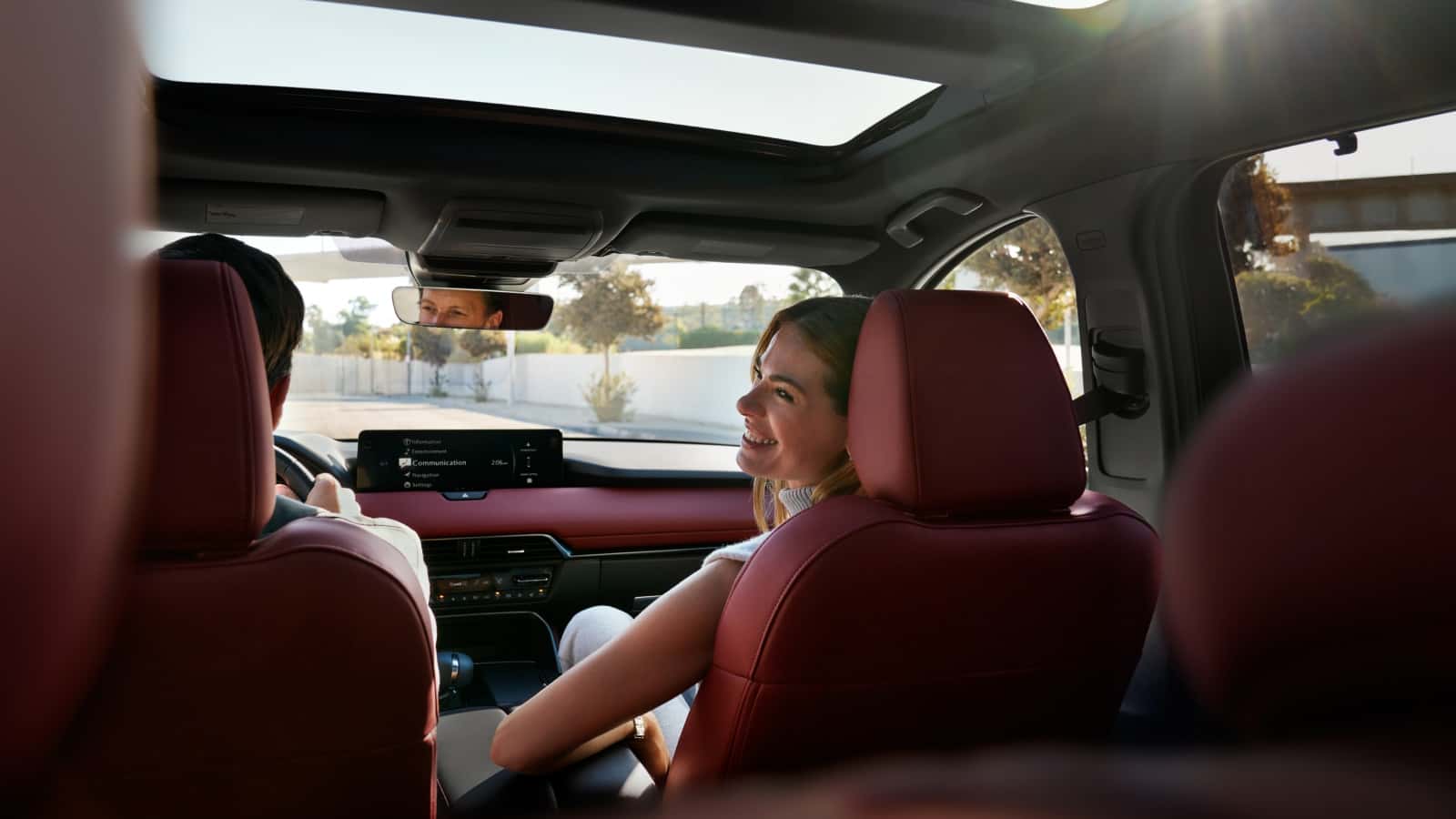 Family sitting inside the Mazda CX-70