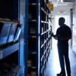 Team member selecting OEM Mazda parts