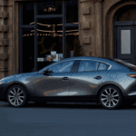 A Mazda sedan parked in the city