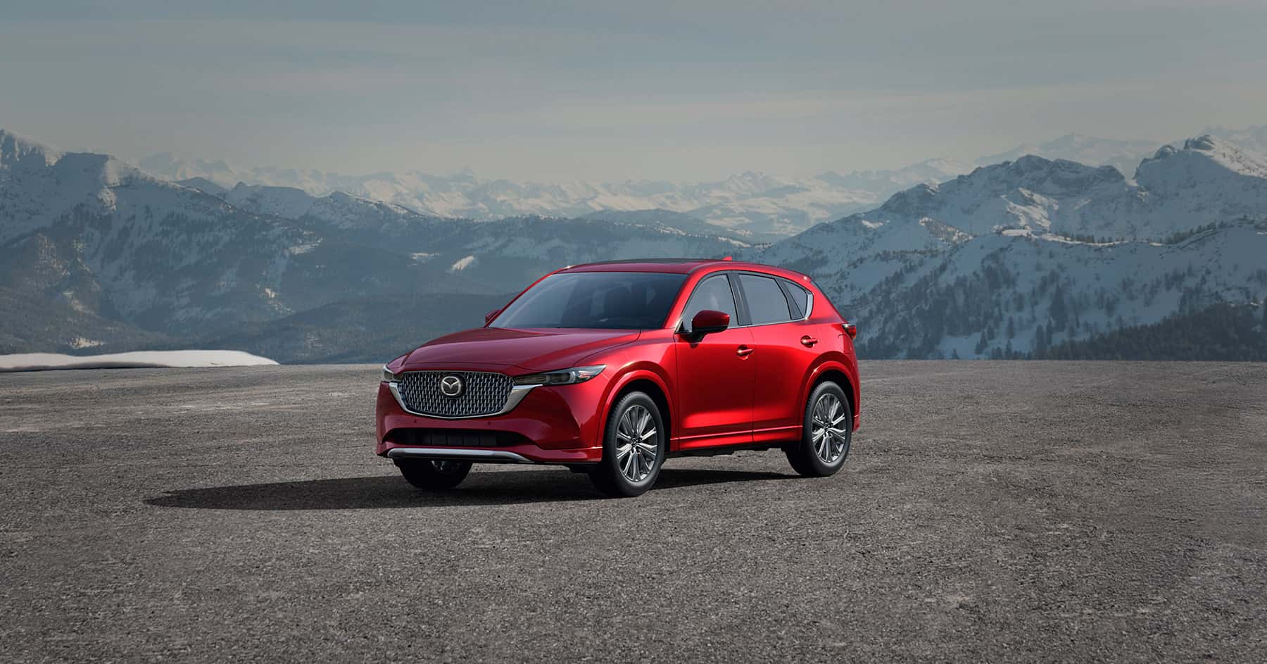 Mazda CX-5 lease vehicle parked against a mountainscape