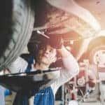 Technician working on an oil change