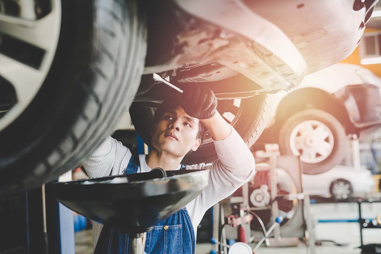 Technician working on an oil change