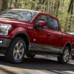 Red 2020 Ford F-150 Towing Boat