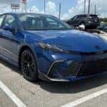 blue 2025 Toyota Camry in a parking lot