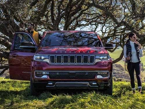 2023 Wagoneer park under trees in a field