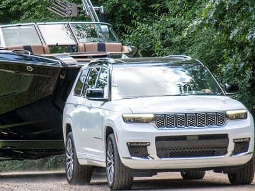 2024 Jeep Grand Cherokee 4xe towing a boat