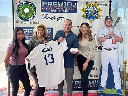 Premier CDJR of Buena Park during receiving an award