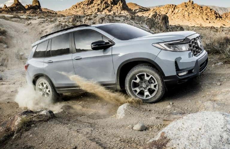 2022 Honda Passport TrailSport driving on rocks