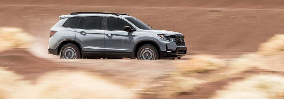 2022 Honda Passport TrailSport driving on dirt road