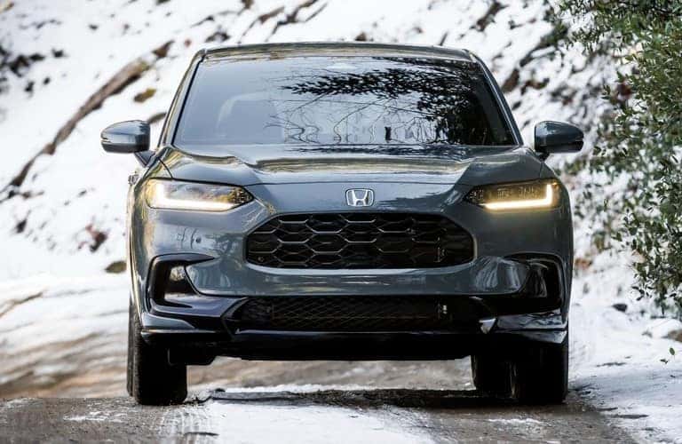 front view of 2023 Honda HR-V driving through the snow