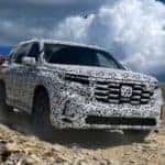 2023 Honda Pilot TrailSport on Hill with Blue, Partly Cloudy Sky