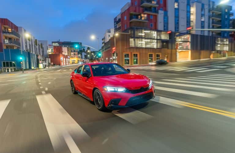 2023 Honda Civic sedan in red on city street