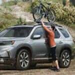 silver honda pilot on trail