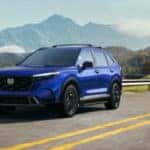 blue honda suv on road