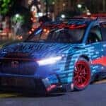 Front Diagonal View of Honda CR-V Hybrid Racer with Headlights On