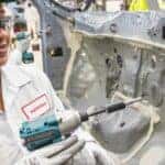 honda auto worker working on a door
