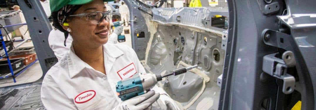 honda auto worker working on a door