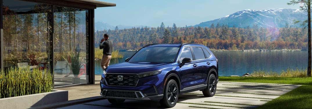 2023 Honda CR-V parked in front of wilderness landscape