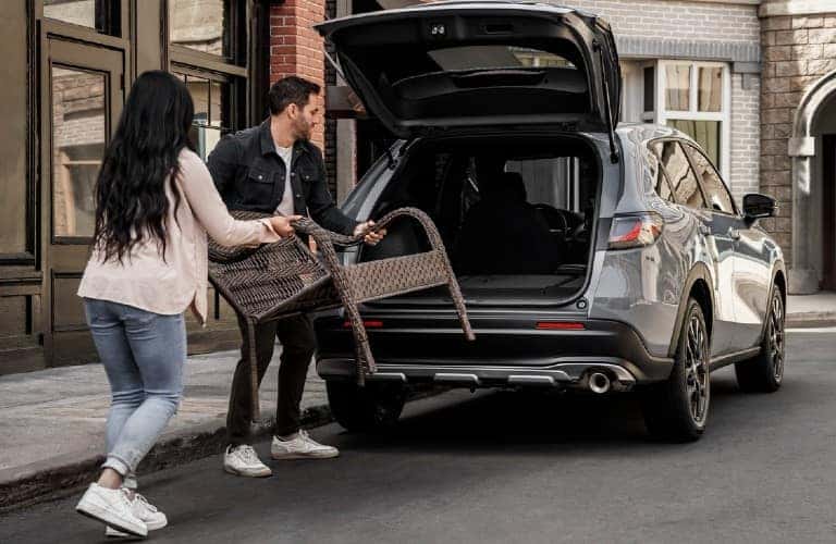 people loading cargo into rear of 2023 Honda HR-V