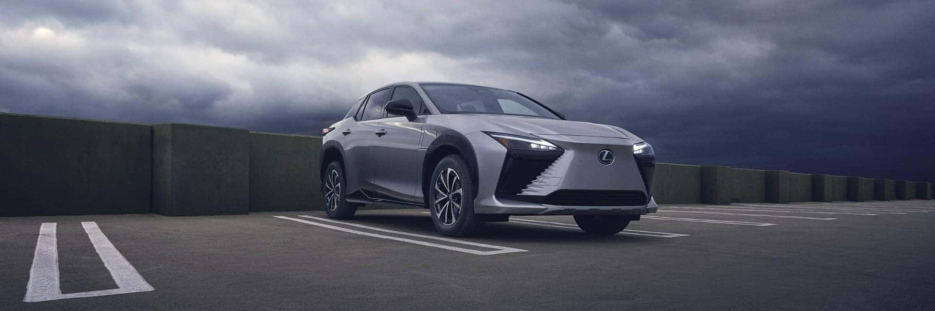 2026 lexus rz parked in parking lot with stormy sky