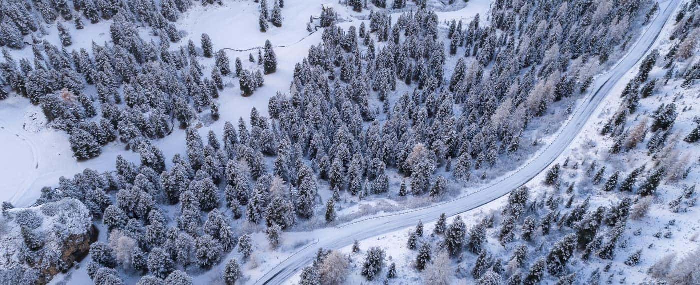 https://di-uploads-pod23.dealerinspire.com/raycatenalexusoflarchmont/uploads/2020/01/snowy-road-in-winter-aerial-view.jpg