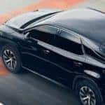 2020 Lexus RX 350 in black driving down track