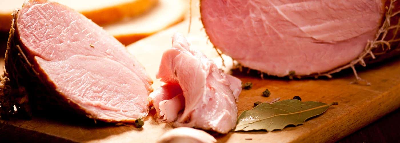 whole smoked ham displayed