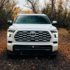 2026 Toyota Sequoia white front view in the woods