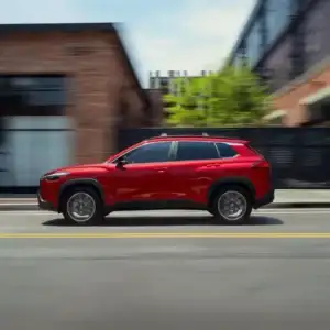 2026 Toyota Corolla Cross Hybrid Driver's Side in Motion