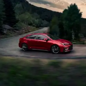 2026 Toyota Corolla Hybrid Passenger Side View in Motion