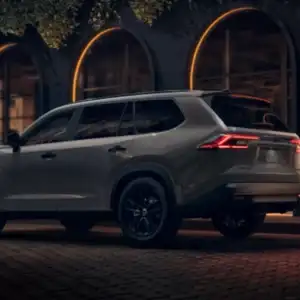 2026 Toyota Grand Highlander Hybrid and Hybrid MAX Driver's Side and Rear 3/4 View