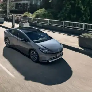 2026 Toyota Prius PHEV Crossing a Bridge