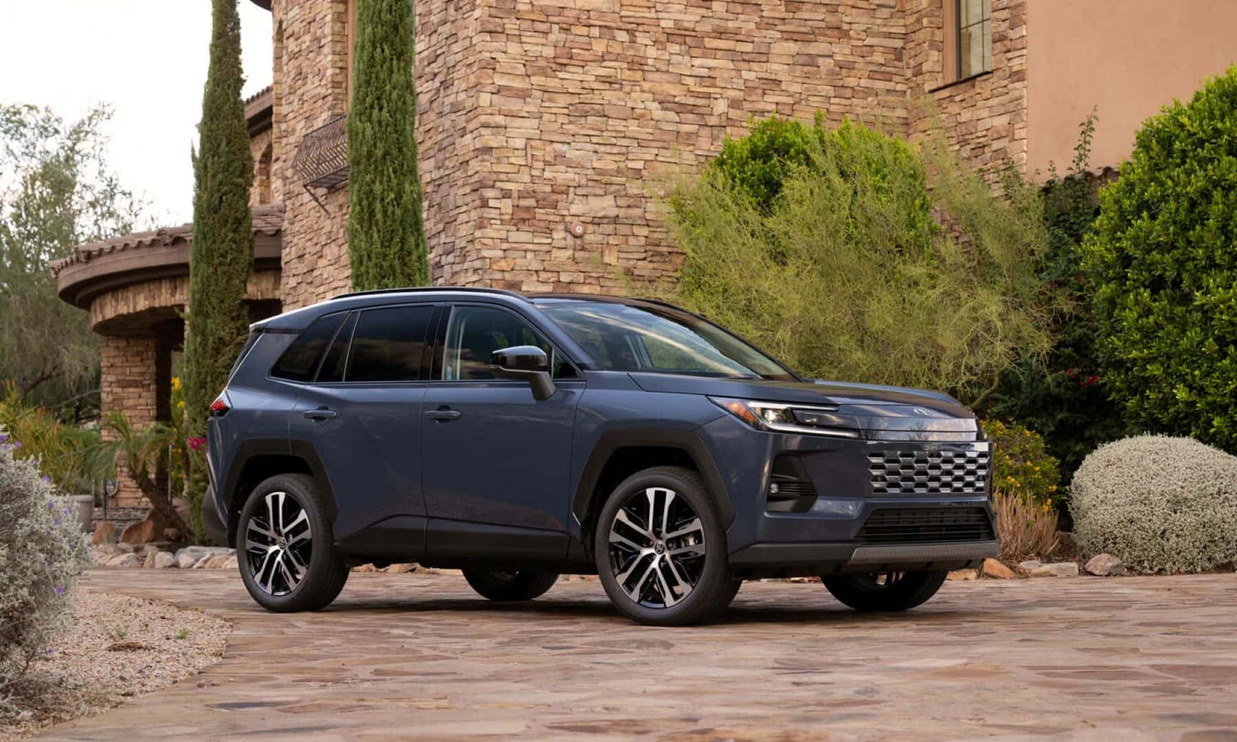 The Ample And Generously Spaced 2026 Toyota RAV4 Parked Outside A Beautiful Home