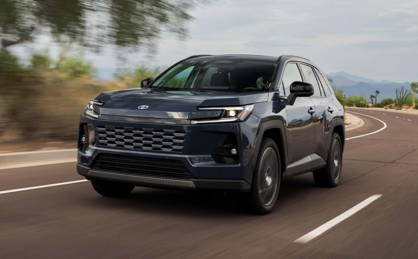 The Unique And Terrific Toyota RAV4 Limited Driving On The Highway, Past Blurred Scenery