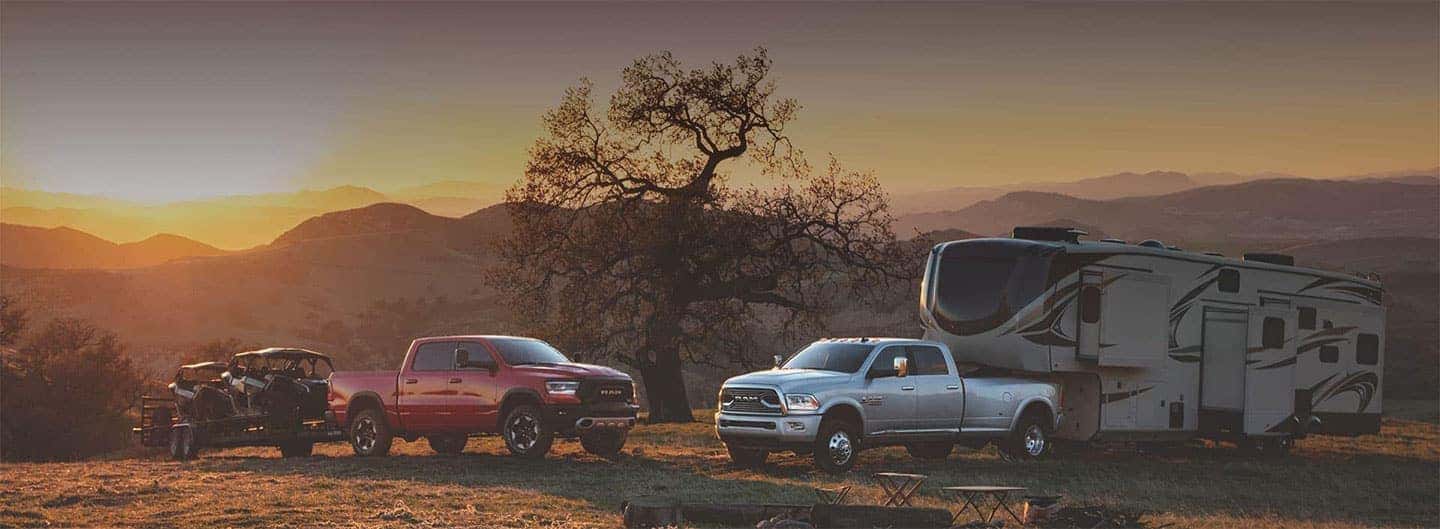 Pickup trucks with trailers out in the wilderness