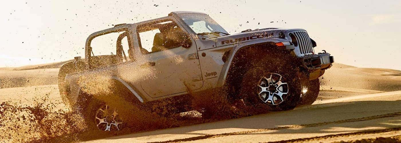 https://di-uploads-pod23.dealerinspire.com/southernchryslerdodgejeepram/uploads/2020/03/Jeep-Wrangler-Off-Roading-Through-Sand.jpg